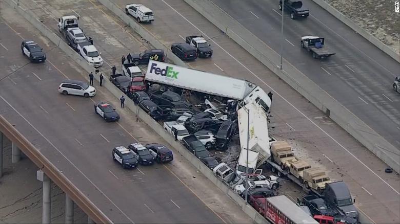 ft. worth big semi truck fed ex crash on interstate. showing lots of cars piled up in center of interstate in texas highway