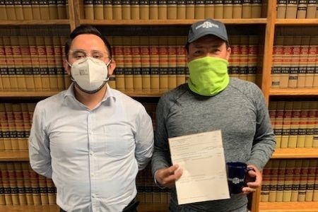 client photo after getting a settlement check