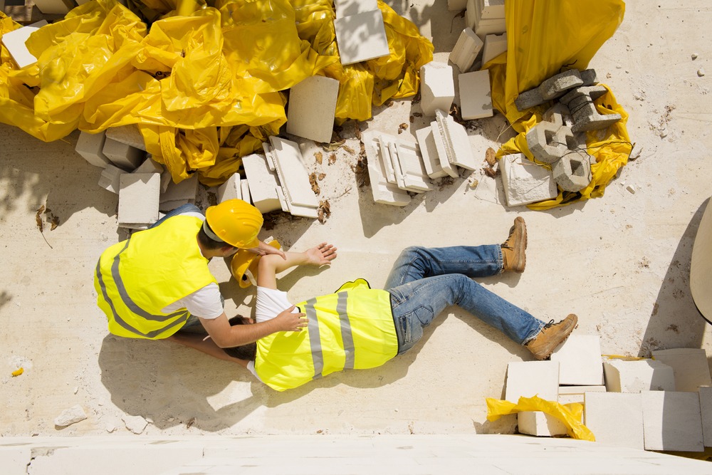 construction-worker-helping-fallen-coworker - Dallas, TX | Domingo Garcia Law Firm